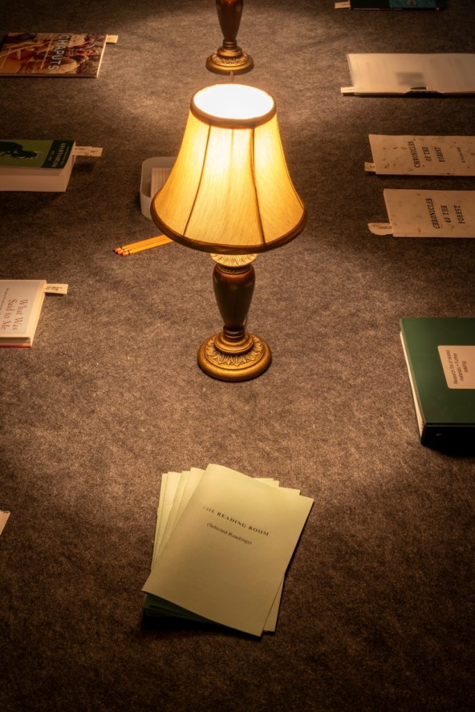 Detail view of the reading room tables and selected reading material.